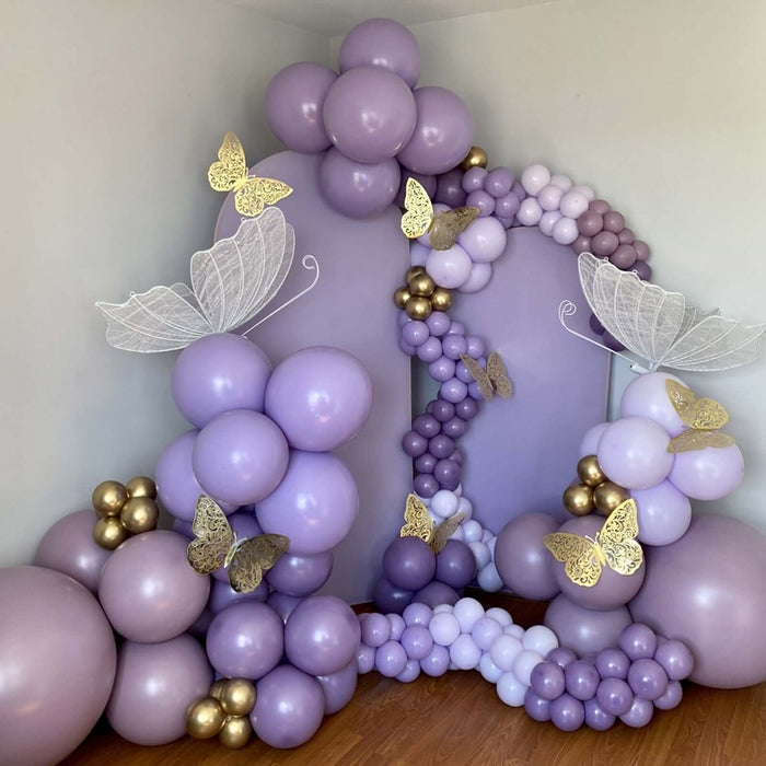 Purple balloon decoration with butterfly accents for events or parties.