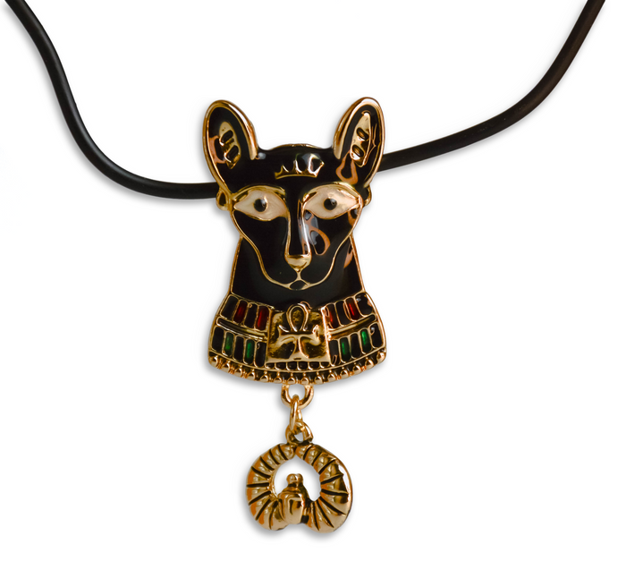 Head of Bastet cat pendant, black color, with red and green neck wear, all with gold detailing. Gold pendant hangs off of it. On black necklace, 
white background
