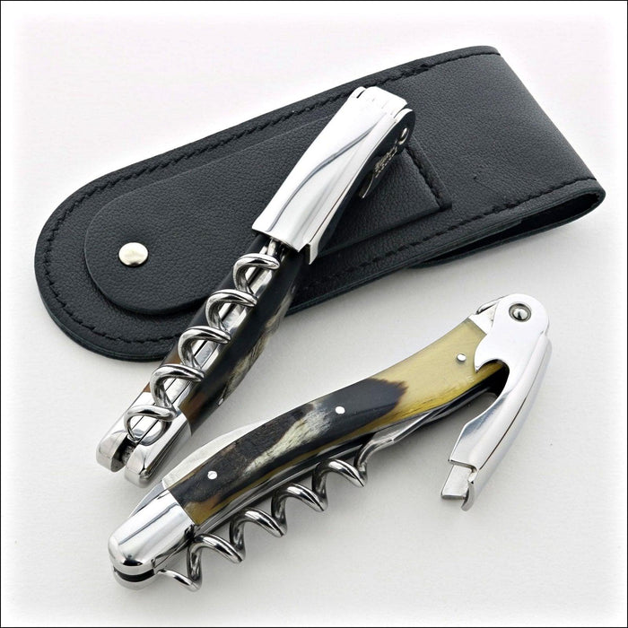 Chateau Laguiole Classic Dark Ram Horn Corkscrew, two corkscrews with dark ram horn handles and polished steel, with a black leather pouch. Handcrafted details, 100% Made in France.