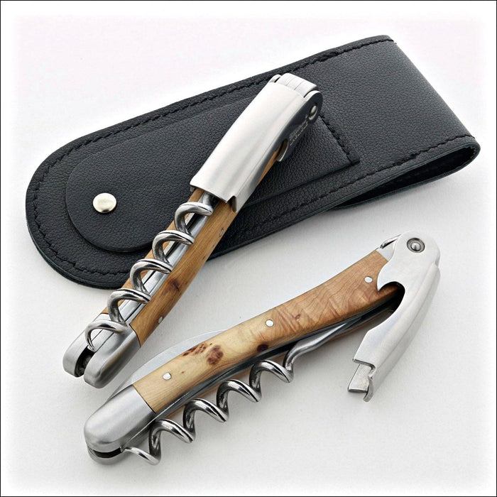 Chateau Laguiole Classic Juniper Corkscrew, close-up of two corkscrews with juniper wood handles and stainless steel, one open, one closed, with a black leather pouch. Handcrafted details, 100% Made in France.