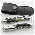 Chateau Laguiole Grand Cru Dark Ram Horn Corkscrew, top-down view of two corkscrews and leather pouch. Handcrafted details, 100% Made in France.