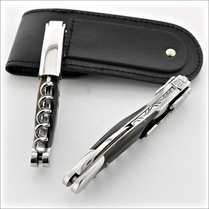 Chateau Laguiole Grand Cru Dark Ram Horn Corkscrew, close-up of two corkscrews with a black leather case. Handcrafted details, 100% Made in France.