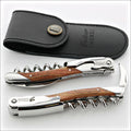 Chateau Laguiole Grand Cru Rosewood Corkscrew, top-down view of two corkscrews and black leather sheath. Handcrafted details, 100% Made in France.