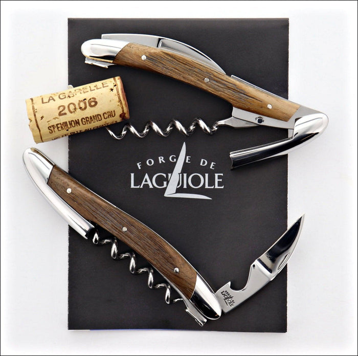 Forge de Laguiole corkscrew, top-down view of two sub-fossilized oak handles with shiny steel accents.
