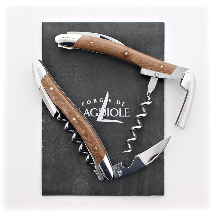 Forge de Laguiole Corkscrew Chocolate: top-down view of two polished steel openers with wood handles.