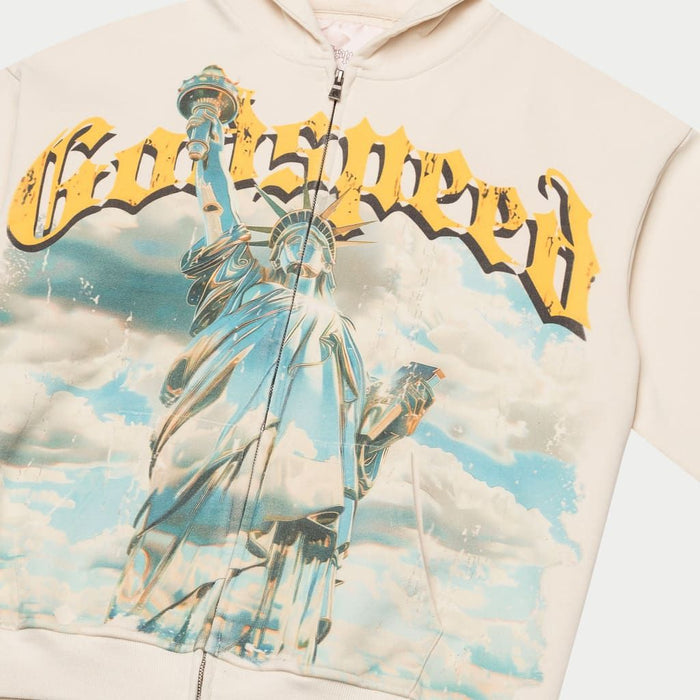 Striking chrome Statue of Liberty on bone colored zip hoodie
