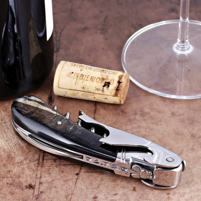 Laguiole Magnum Dark Ram Horn Corkscrew, close-up side view of polished horn handle and steel frame.