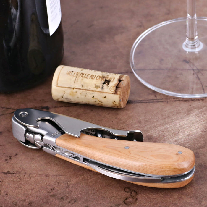 Laguiole Magnum Juniper Corkscrew, close-up of the light wood handle and stainless steel tools.