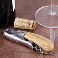 Laguiole Magnum Olive Wood Corkscrew, close-up of the olive wood handle and polished steel body.