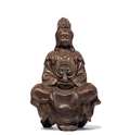 Guanyin statue with rock-like finish, holding small vase. Her eyes are closed and she is calm-looking.