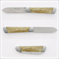 Pradel Folding Knife Light Horn Tip Handle. Close-up of the light horn handle with metal bolsters. Handcrafted details, 100% Made in France.