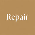 The word 'Repair' in white serif lettering centered on a solid warm tan background.